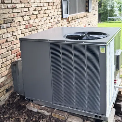 Package HVAC unit installed at home, from L&L Mechanical Services’s own photographs.