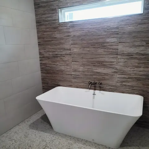 Freestanding tub install, from PrimeTime Plumbing’s own photographs.