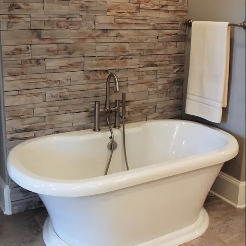 Freestanding tub with floor-mount filler, from Watson Plumbing, Inc.’s own photographs.